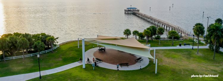 Aerial shot of Waterfront Park looking over shade sails into the Bay and pier